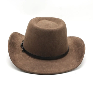 Close-up of brown western cowboy hat with black leather band and metal rivets