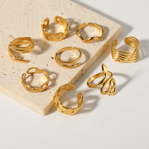 8-piece set of gold stainless steel open rings with snake, feather and braided designs