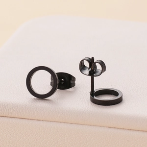 Minimalist matte black stainless steel hoop stud earrings shown on jewelry box