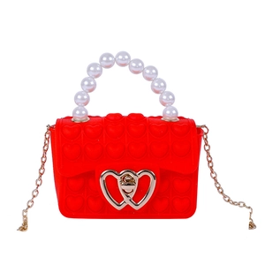 Red silicone heart pop-it crossbody bag for kids with pearl handle and golden chain