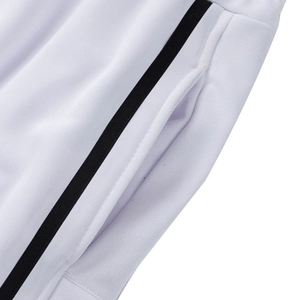 Detail view of heavy cotton sweatpants featuring black side stripe and secure pocket stitching