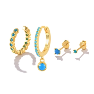 Detail showing 925 silver hallmarks on gold turquoise earrings and single stud set