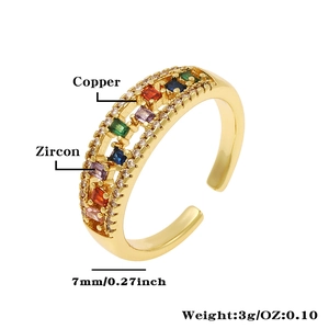 Macro detail of adjustable copper ring with colorful zircons and gold plating