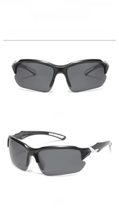 Close-up of black sports sunglasses with white accents and dark polarized lenses