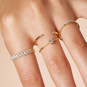 Elegant S925 sterling silver gold twisted rings set with sparkling cubic zirconia stones