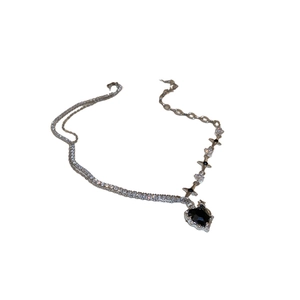 Chic silver necklace with black heart pendant and sparkling rhinestone star chain links