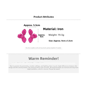 Detailed view of large rose pink flower earrings showing iron material and dimensions