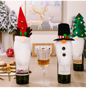 Detailed Christmas wine bottle covers featuring reindeer antlers, top hat, and tree designs