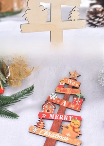 Close-up of wooden Christmas tree decor with festive gingerbread and gift box patterns