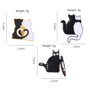 Three creative black and white cat enamel pins featuring hugging cats and funny knife designs