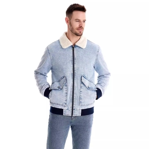 Detail of men's sherpa-lined denim jacket featuring white fleece collar and ribbed cuffs