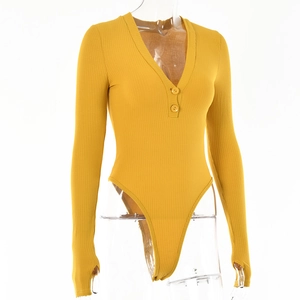 Detail of yellow ribbed knit bodysuit with deep V-neckline, buttons and thumbhole sleeves
