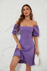 Close-up of the puff sleeves and square neckline on a purple textured summer dress
