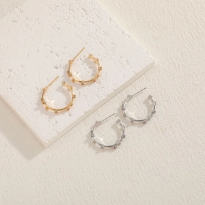 Elegant gold and silver C-shaped hoop earrings with colorful zircon gemstones