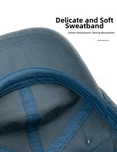 Detail view of cotton sweatband on washed blue baseball cap with soft twill stitching