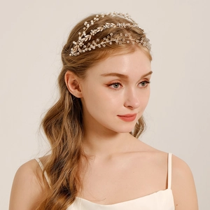 Detail of bridal headband featuring gold leaf motifs with pearls and crystal beads
