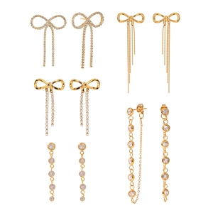 Golden bow rhinestone earrings set featuring elegant long tassels and crystal studs