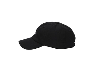 Detailed view of white letter embroidery on black cotton sports baseball cap fabric