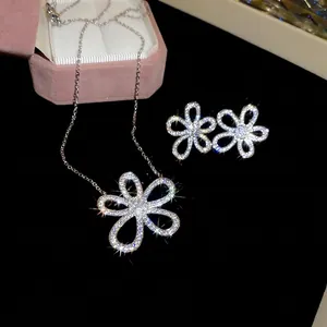 Elegant floral jewelry set with sparkling crystals on necklace and stud earrings