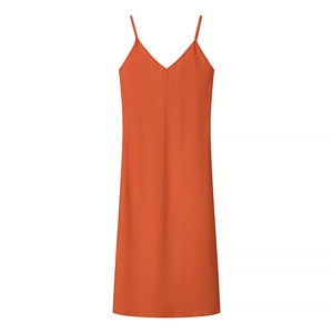 Detail view of the deep V-neckline and orange fabric texture of the summer dress