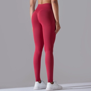 Detailed back view of high-waisted seamless yoga pants with V-shaped peach hip lifting seams
