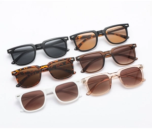 Detailed view of square sunglasses collection with multiple frame colors and rivet accents