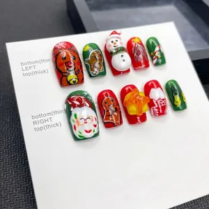 Handmade 3D Christmas press-on nails with Santa Claus, reindeer, and festive embossed art