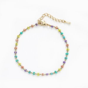 Detail of colorful beads on gold plated bohemian chain bracelet with lobster clasp