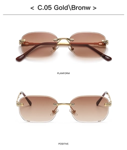 Detail view of gold rimless sunglasses with rhinestone accents and brown gradient lenses