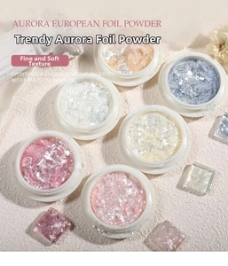 Detailed view of aurora opal nail powder jars with iridescent flakes on marble texture