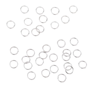Multiple silver open jump rings for DIY jewelry making on a clean white background