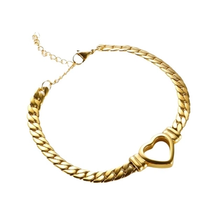Polished gold curb chain bracelet with hollow heart pendant and adjustable lobster clasp