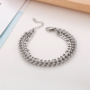 Detail of silver double-layered stainless steel chain bracelet with lobster clasp