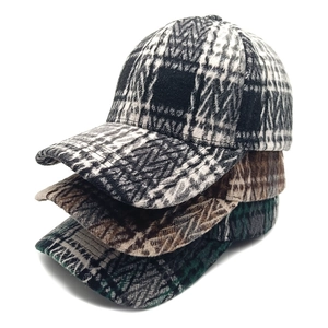 Three vintage plaid baseball caps in thick wool fabric with classic curved brims