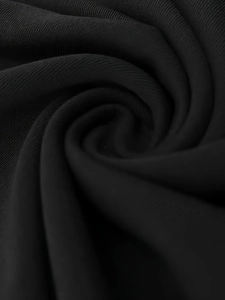 Macro shot of high-quality black knitted rib fabric texture with soft shadows for men's set