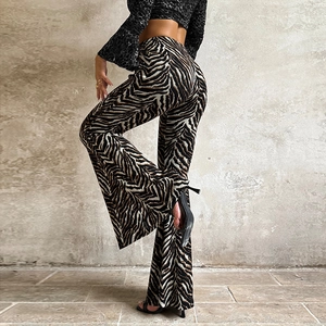 Detailed view of high waisted zebra print flared pants with elastic fabric texture