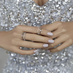 Close-up of 925 sterling silver double-layer cross ring set with sparkling zircon stones