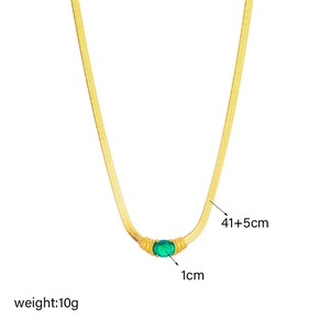 Detailed view of golden snake chain necklace with green gem, 41+5cm length and 1cm pendant