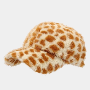 Close-up of the plush faux fur texture on a giraffe print baseball cap with brown spots
