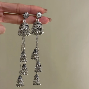 Vintage bohemian silver Jhumka earrings with tiered bells and ethnic geometric patterns