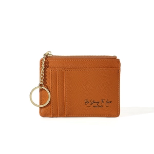 Detail of brown PU leather card holder with metal keychain and multiple card slots