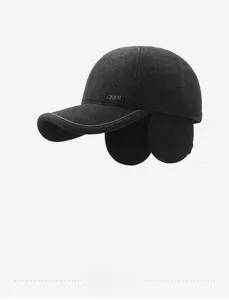 Close-up of dark grey wool baseball cap with ear flaps and metal CHINA lettering detail