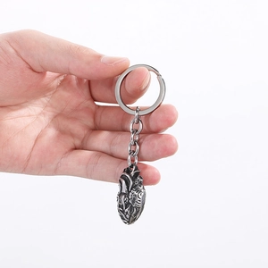 Silver stainless steel keychain featuring a detailed anatomical heart model design