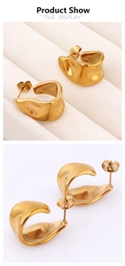 Detailed macro view of 18K gold plated stainless steel U-shaped earrings with irregular fold