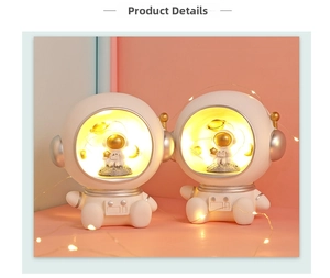 Detail view of astronaut night light with warm LED fairy lights and resin texture