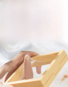 Close-up of flexible PE film on jewelry box showing high elasticity and puncture resistance