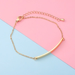 Macro shot of adjustable golden titanium steel bracelet with curved bar and lobster clasp