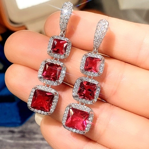 Sparkling silver drop earrings with three-tier red square cubic zirconia stones