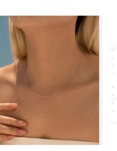 Close-up of minimalist S925 sterling silver ultra-thin choker necklace on a female model