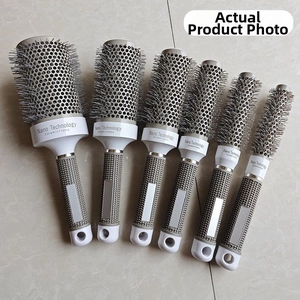 Detail of professional thermal ceramic round brush set with gray anti-slip handle
